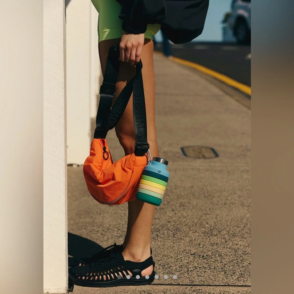 NWT Free People FP Movement Bulls Eye Sling Bag Tangerine